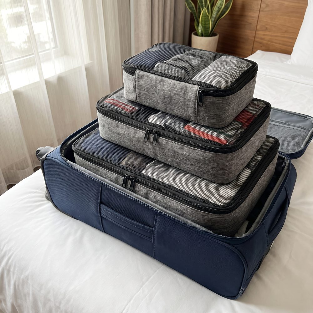 Packing cubes stacked in a suitcase